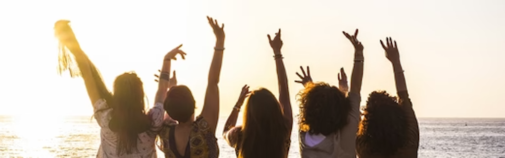 5 woman standing with their hands up