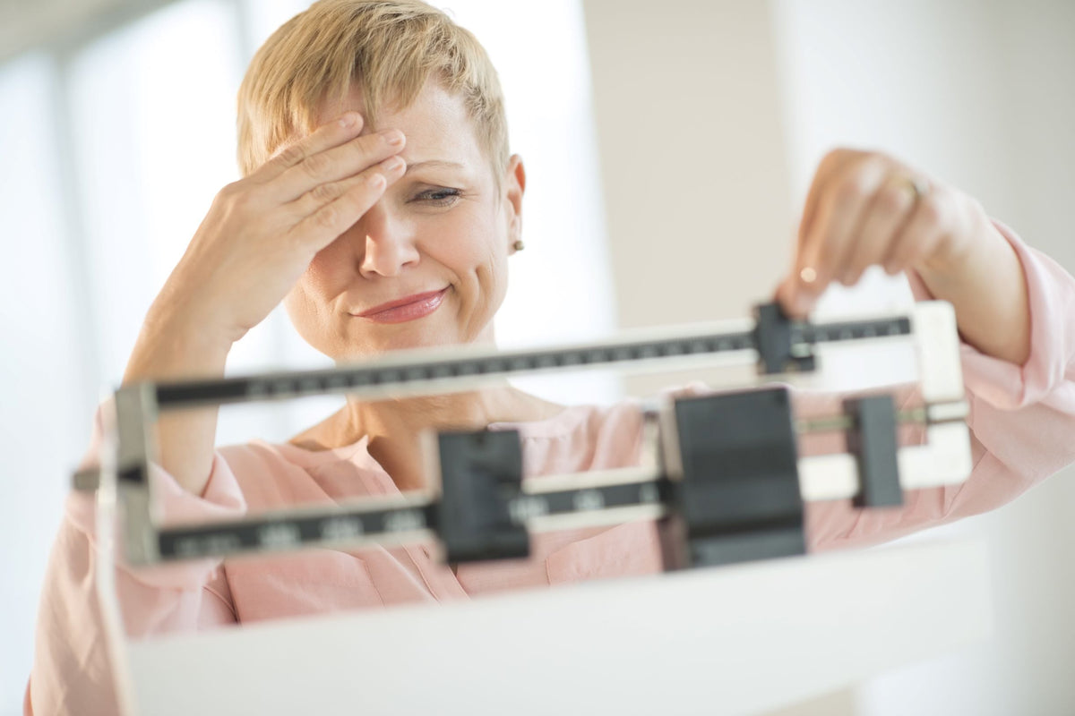 woman looking at scale