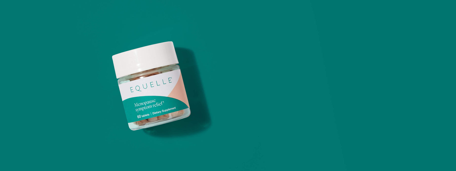 Equelle bottle on a green background